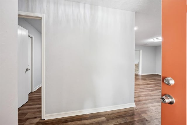 4328 NW 12th St, Oklahoma City, OK 73107 - hallway with dark wood-style flooring and baseboards