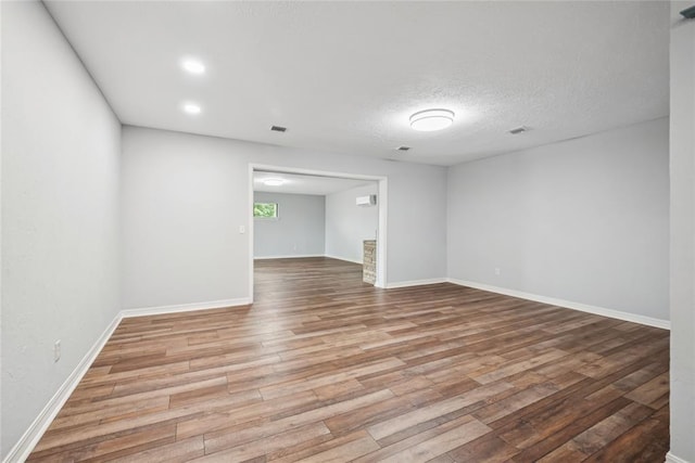 4328 NW 12th St, Oklahoma City, OK 73107 - empty room with wood finished floors, baseboards, and a textured ceiling