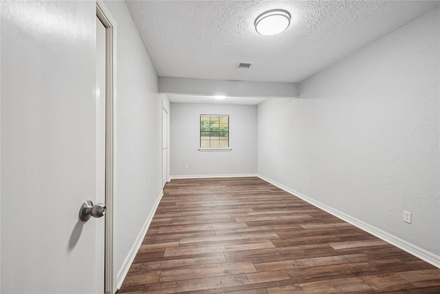 4328 NW 12th St, Oklahoma City, OK 73107 - unfurnished room with a textured ceiling, wood finished floors, and baseboards