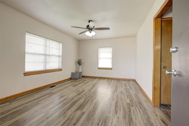 520 SE 47th St, Oklahoma City, OK 73129 - empty room featuring wood finished floors, ceiling fan, and baseboards
