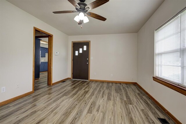 520 SE 47th St, Oklahoma City, OK 73129 - entrance foyer with light wood-style flooring, baseboards, and ceiling fan
