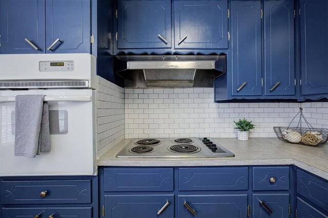 520 SE 47th St, Oklahoma City, OK 73129 - kitchen with oven, blue cabinetry, electric stovetop, and light countertops