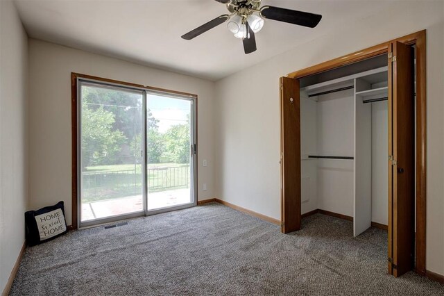 520 SE 47th St, Oklahoma City, OK 73129 - unfurnished bedroom featuring access to outside, carpet flooring, baseboards, ceiling fan, and a closet