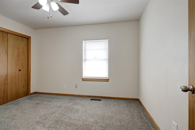 520 SE 47th St, Oklahoma City, OK 73129 - unfurnished bedroom with carpet floors, a closet, baseboards, and ceiling fan