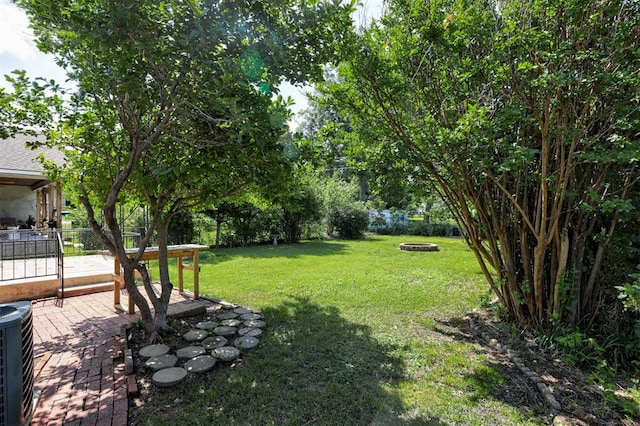520 SE 47th St, Oklahoma City, OK 73129 - view of yard with a fire pit, a patio, and central air condition unit