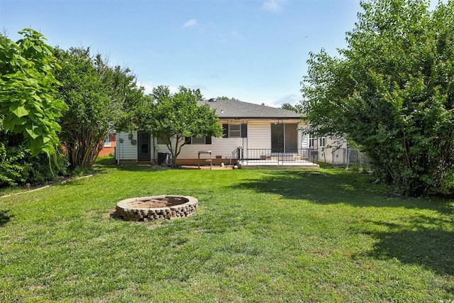 520 SE 47th St, Oklahoma City, OK 73129 - rear view of house with an outdoor fire pit
