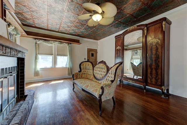 2113 N Gatewood Ave, Oklahoma City, OK 73106 - living area with an ornate ceiling, wood finished floors, ceiling fan, ornamental molding, and baseboards
