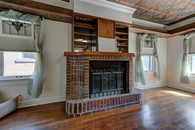 2113 N Gatewood Ave, Oklahoma City, OK 73106 - unfurnished living room with baseboards, wood finished floors, a fireplace, an ornate ceiling, and crown molding