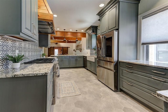 2113 N Gatewood Ave, Oklahoma City, OK 73106 - kitchen with appliances with stainless steel finishes, gray cabinets, plenty of natural light, recessed lighting, and backsplash