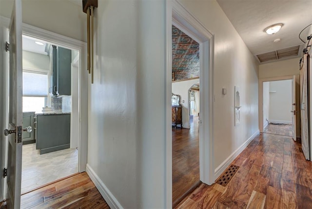 2113 N Gatewood Ave, Oklahoma City, OK 73106 - hallway featuring wood finished floors and baseboards