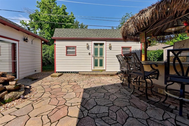 2113 N Gatewood Ave, Oklahoma City, OK 73106 - view of patio / terrace featuring an outbuilding