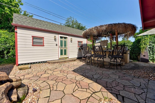 2113 N Gatewood Ave, Oklahoma City, OK 73106 - view of patio with an outbuilding