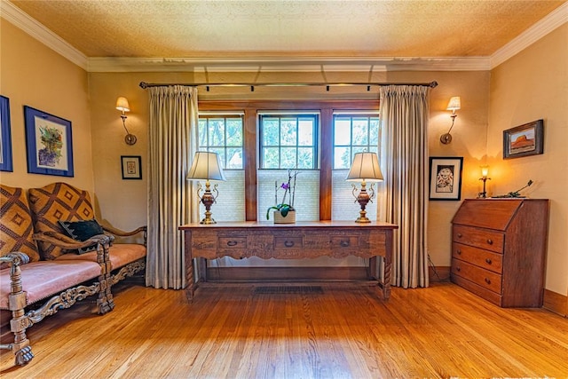 1527 NW 35th St, Oklahoma City, OK 73118 - living area featuring hardwood / wood-style flooring, ornamental molding, and a textured ceiling