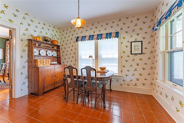 1527 NW 35th St, Oklahoma City, OK 73118 - dining space featuring wallpapered walls, tile patterned flooring, baseboards, and ornamental molding