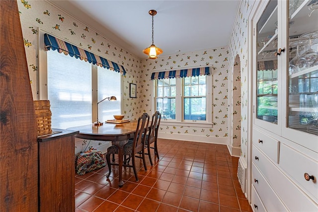 1527 NW 35th St, Oklahoma City, OK 73118 - dining room with wallpapered walls, dark tile patterned flooring, and baseboards