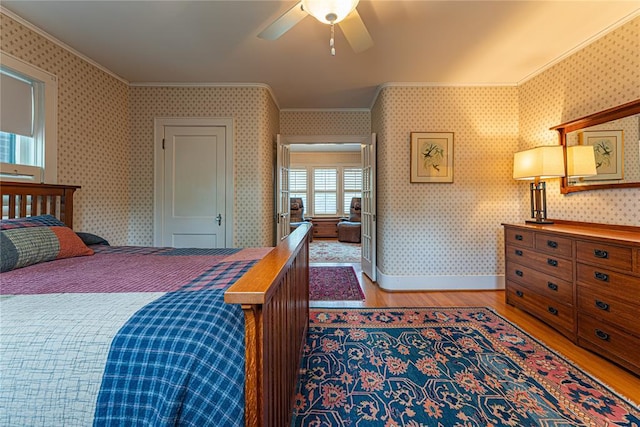 1527 NW 35th St, Oklahoma City, OK 73118 - bedroom featuring light wood-type flooring, ornamental molding, wallpapered walls, and baseboards