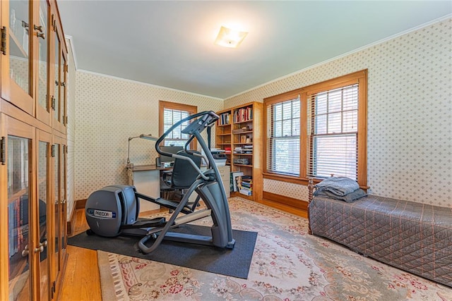 1527 NW 35th St, Oklahoma City, OK 73118 - workout area featuring wallpapered walls, wood finished floors, and ornamental molding
