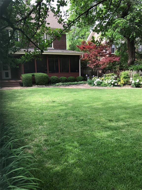 1527 NW 35th St, Oklahoma City, OK 73118 - view of grassy yard featuring a sunroom