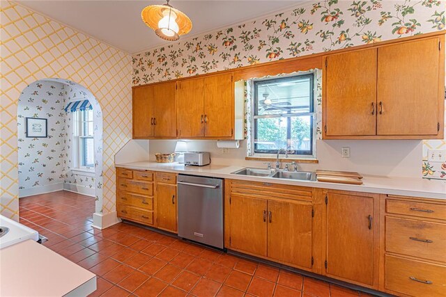 1527 NW 35th St, Oklahoma City, OK 73118 - kitchen featuring stainless steel dishwasher, wallpapered walls, a sink, light countertops, and light tile patterned flooring