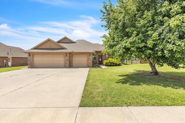 104 Southpointe Ave, Tuttle, OK 73089 - view of front of property with brick siding, a garage, driveway, a front lawn, and a shingled roof