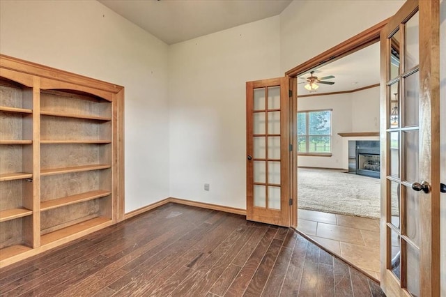 104 Southpointe Ave, Tuttle, OK 73089 - empty room with french doors, baseboards, and a fireplace with flush hearth