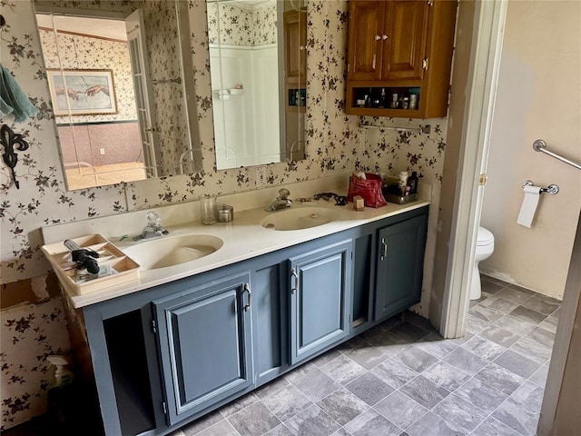 19350 8 A St, Norman, OK 73026 - full bathroom featuring wallpapered walls, double vanity, and toilet