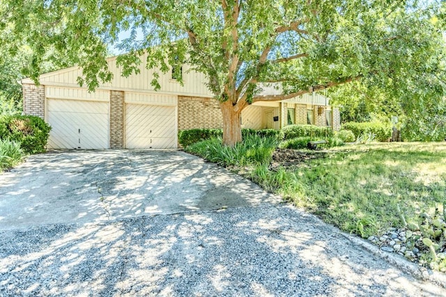 829 Douglas Dr, Norman, OK 73069 - multi unit property with brick siding, driveway, and an attached garage
