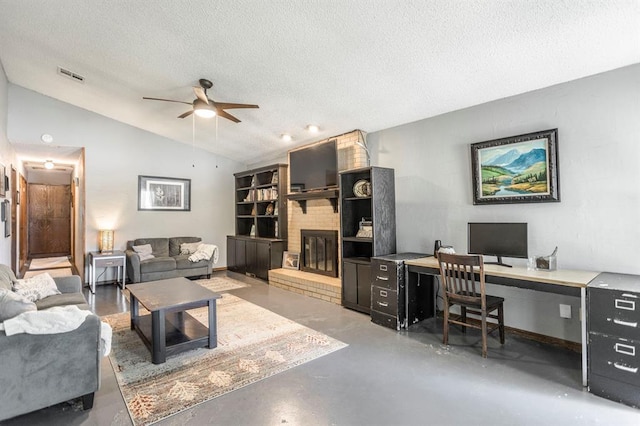 829 Douglas Dr, Norman, OK 73069 - living room with finished concrete floors, vaulted ceiling, a ceiling fan, a textured ceiling, and a fireplace