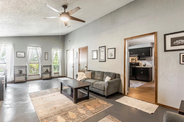 829 Douglas Dr, Norman, OK 73069 - living room with a ceiling fan, a textured ceiling, vaulted ceiling, and concrete flooring