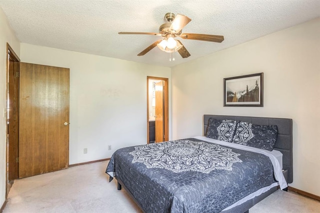 829 Douglas Dr, Norman, OK 73069 - carpeted bedroom featuring baseboards, ceiling fan, and a textured ceiling