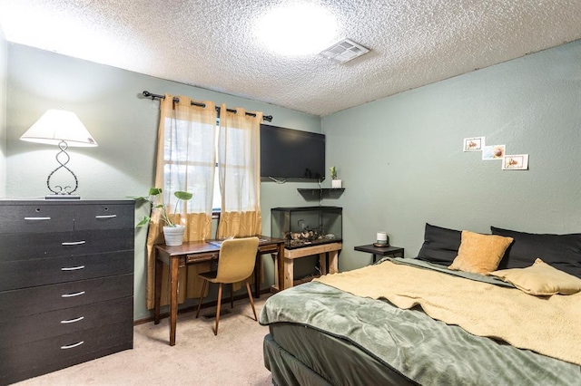 829 Douglas Dr, Norman, OK 73069 - bedroom featuring light carpet, an office area, and a textured ceiling