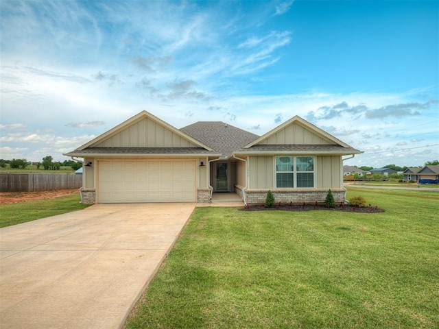 1940 Eli Ave, Tuttle, OK 73089 - view of front of house with driveway, board and batten siding, a garage, and brick siding