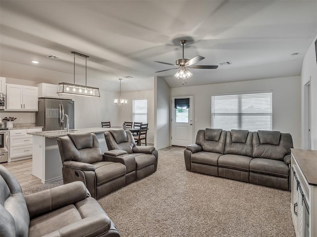 1940 Eli Ave, Tuttle, OK 73089 - living area featuring ceiling fan, a chandelier, light carpet, and baseboards