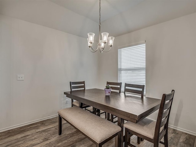 1940 Eli Ave, Tuttle, OK 73089 - dining room with a chandelier, dark wood-type flooring, and baseboards
