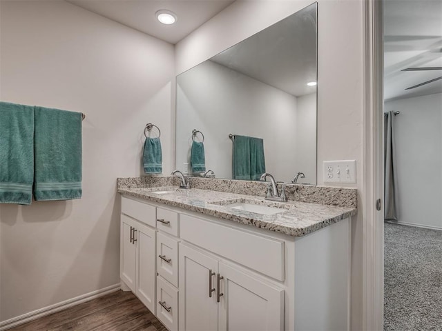 1940 Eli Ave, Tuttle, OK 73089 - full bath with double vanity, baseboards, and wood finished floors