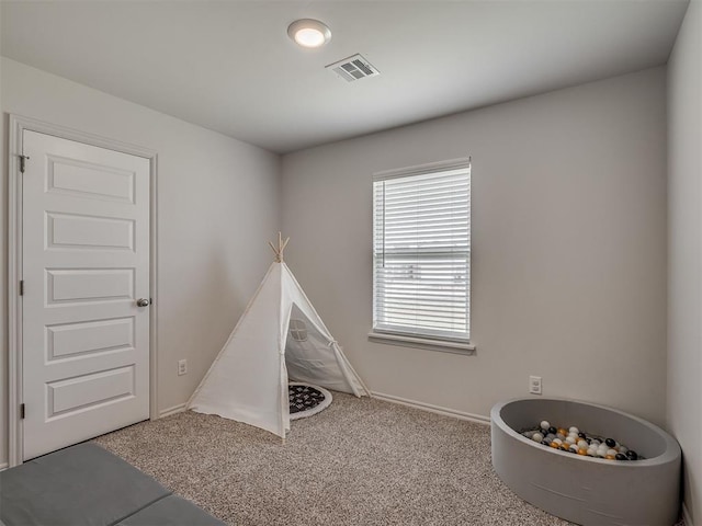1940 Eli Ave, Tuttle, OK 73089 - playroom with carpet floors and baseboards