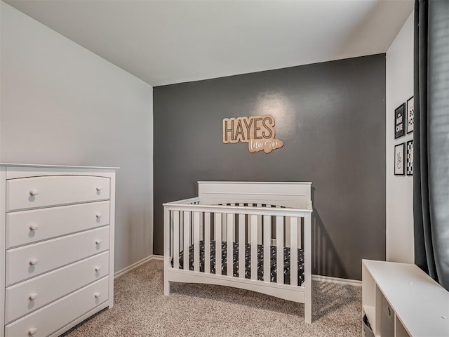 1940 Eli Ave, Tuttle, OK 73089 - bedroom featuring carpet floors, baseboards, and a nursery area
