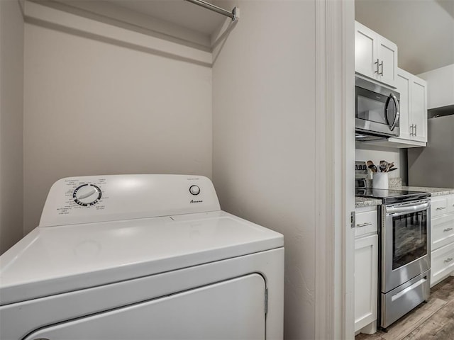 1940 Eli Ave, Tuttle, OK 73089 - washroom featuring washer / dryer and light wood-style floors