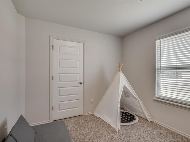 1940 Eli Ave, Tuttle, OK 73089 - playroom featuring plenty of natural light, carpet floors, and baseboards