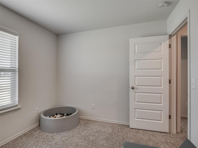 1940 Eli Ave, Tuttle, OK 73089 - carpeted empty room with a smoke detector and baseboards