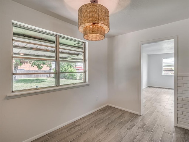 2117 SW 76th St, Oklahoma City, OK 73159 - empty room with light wood-type flooring and baseboards