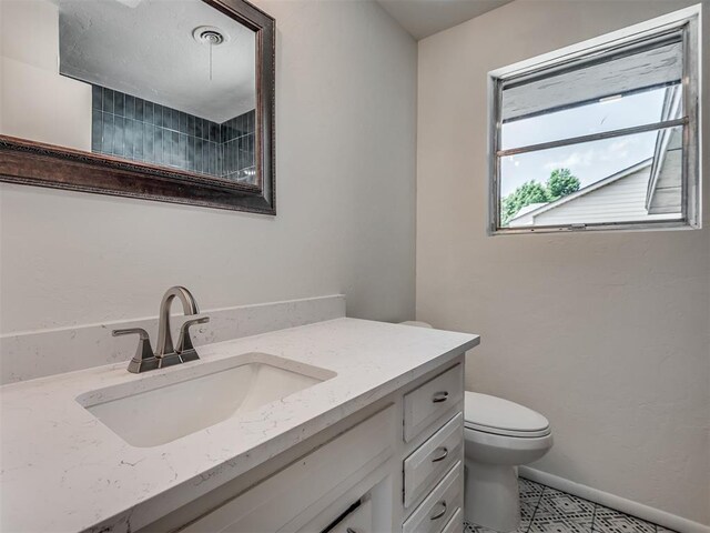 2117 SW 76th St, Oklahoma City, OK 73159 - bathroom with vanity and toilet