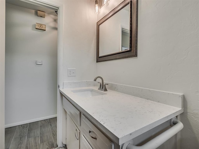 2117 SW 76th St, Oklahoma City, OK 73159 - bathroom featuring vanity and baseboards