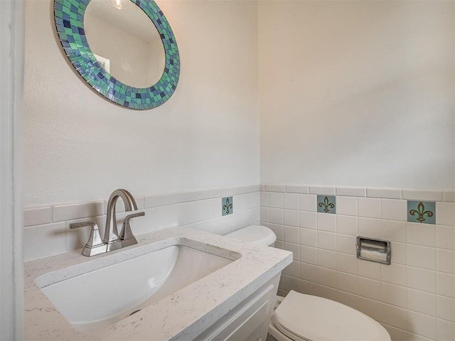 2117 SW 76th St, Oklahoma City, OK 73159 - half bath with toilet, vanity, and tile walls