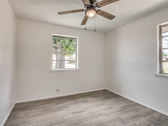 2117 SW 76th St, Oklahoma City, OK 73159 - unfurnished room with wood finish floors, baseboards, and ceiling fan