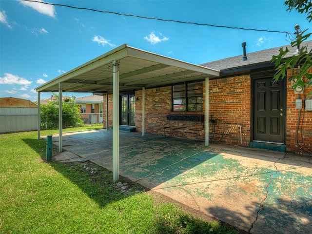 2117 SW 76th St, Oklahoma City, OK 73159 - back of property featuring a patio area, brick siding, and french doors