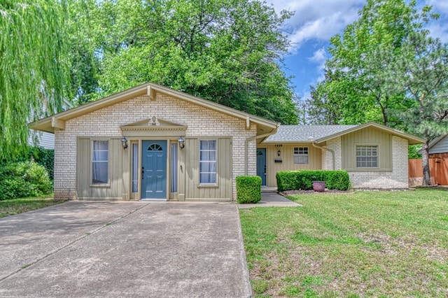 1439 Greenbriar Dr, Norman, OK 73072 - view of front of home with brick siding, board and batten siding, and concrete driveway