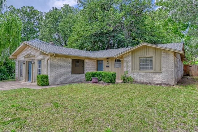 1439 Greenbriar Dr, Norman, OK 73072 - single story home featuring brick siding, roof with shingles, and board and batten siding
