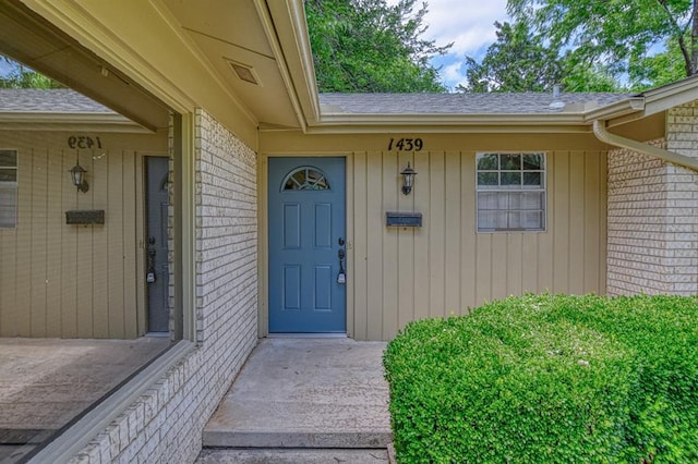 1439 Greenbriar Dr, Norman, OK 73072 - doorway to property with brick siding and roof with shingles