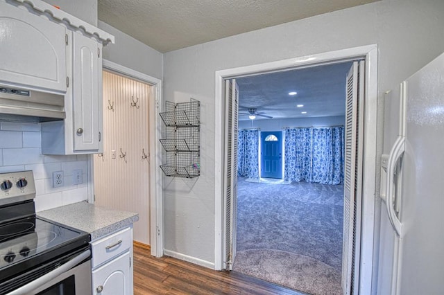 1439 Greenbriar Dr, Norman, OK 73072 - kitchen with white refrigerator with ice dispenser, electric range, dark wood-style flooring, light countertops, and decorative backsplash